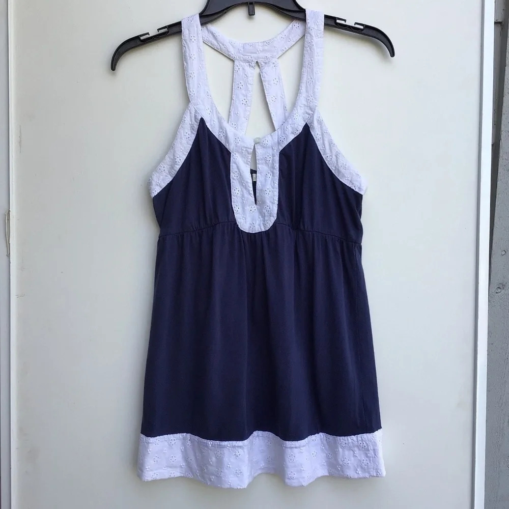 Nicolette blue summer blouse with thick white embroidered trim.  Medium.…​​​​​​